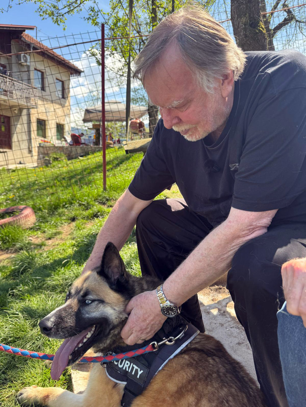 Rick playing with a dog
